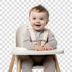 فایل لایه باز پسر بچه خوشحال در صندلی غذا